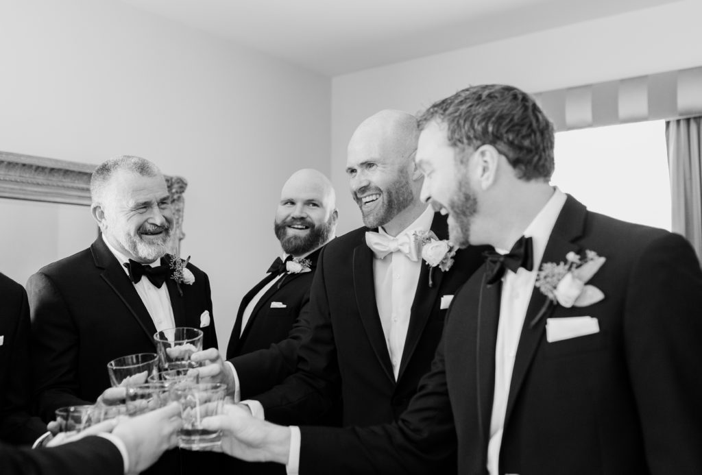 Groomsmen toasting during getting ready photos