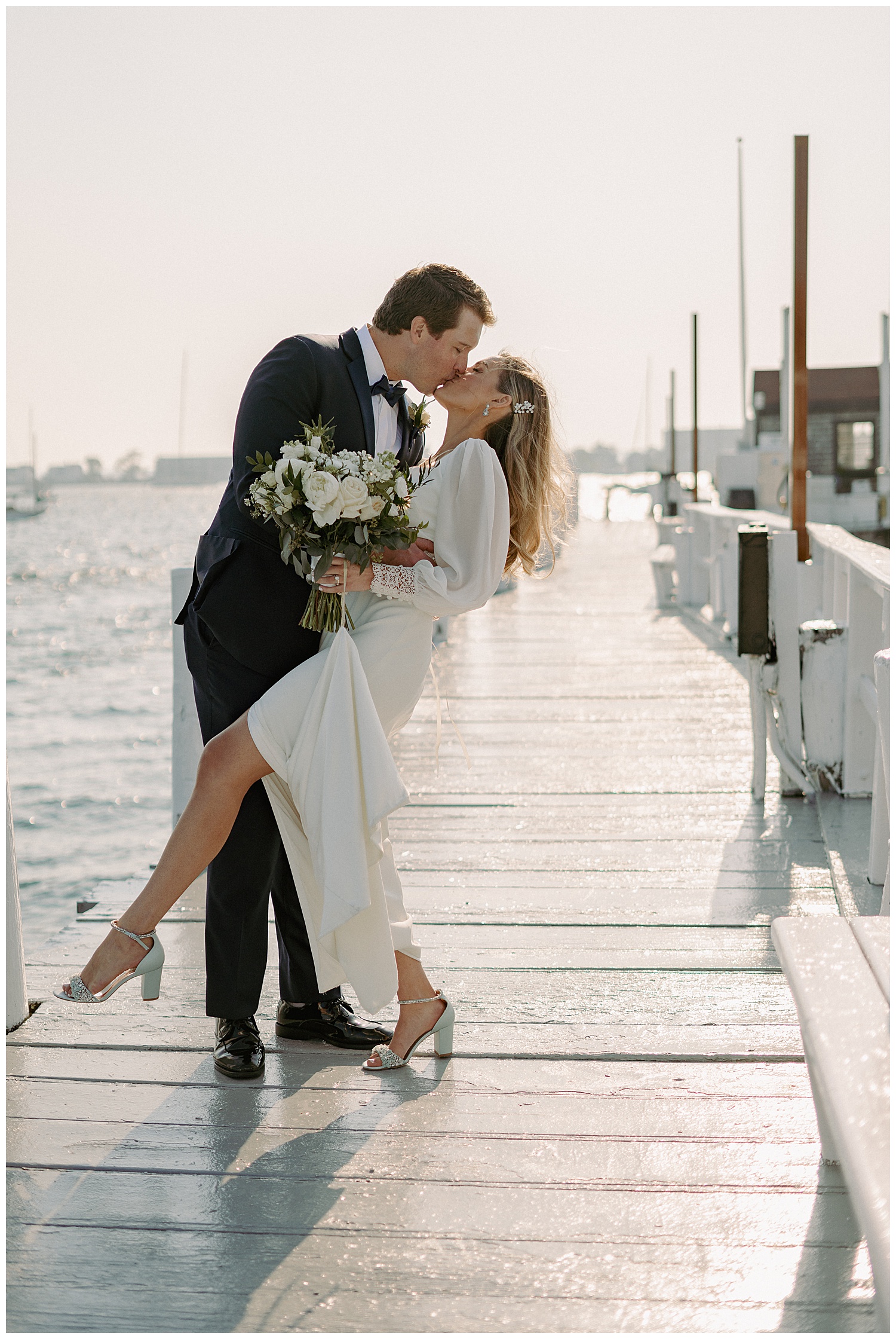 Chic Downtown Newport Wedding Photos of Bride and Groom on Bowens Wharf