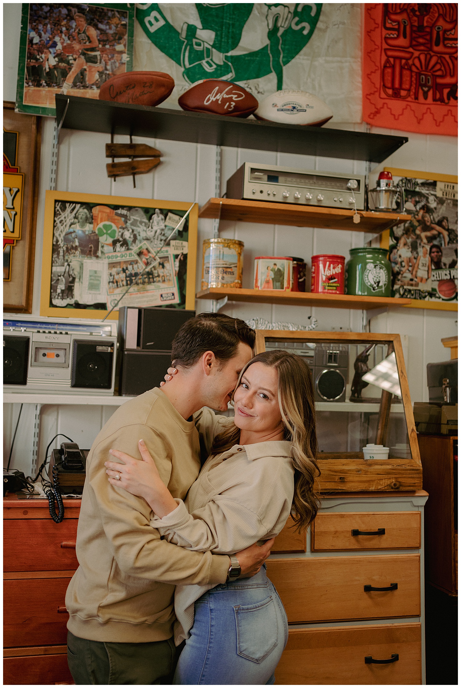 Couple embracing in the antique store during their engagement session